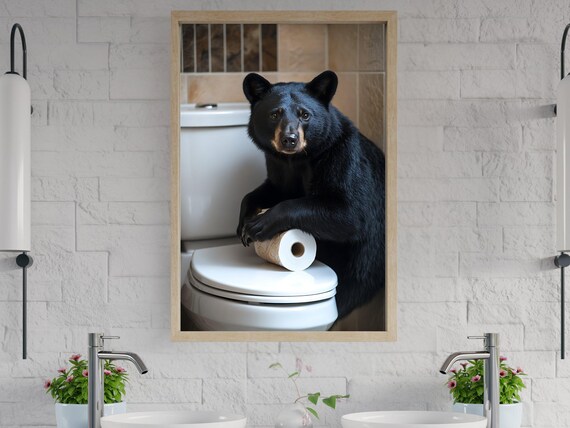 Black Bear Leaning on a Toilet With a Roll of Toilet Paper Poster