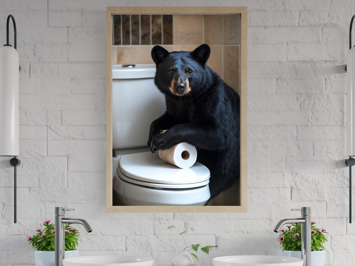 Black Bear Leaning on a Toilet With a Roll of Toilet Paper Poster