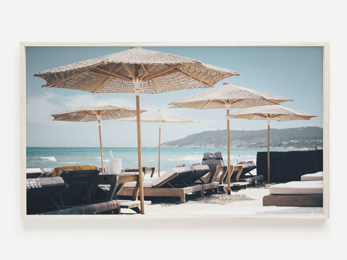 Straw Beach Umbrellas And Wooden Loungers At Seaside Cabana Poster