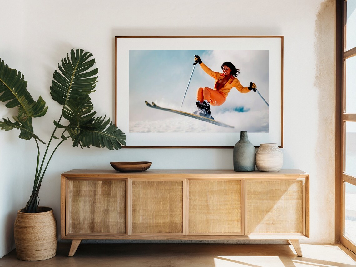 Vintage Skier Woman In Orange Jumpsuit Mid Air Jump Retro Ski Poster - Image 3