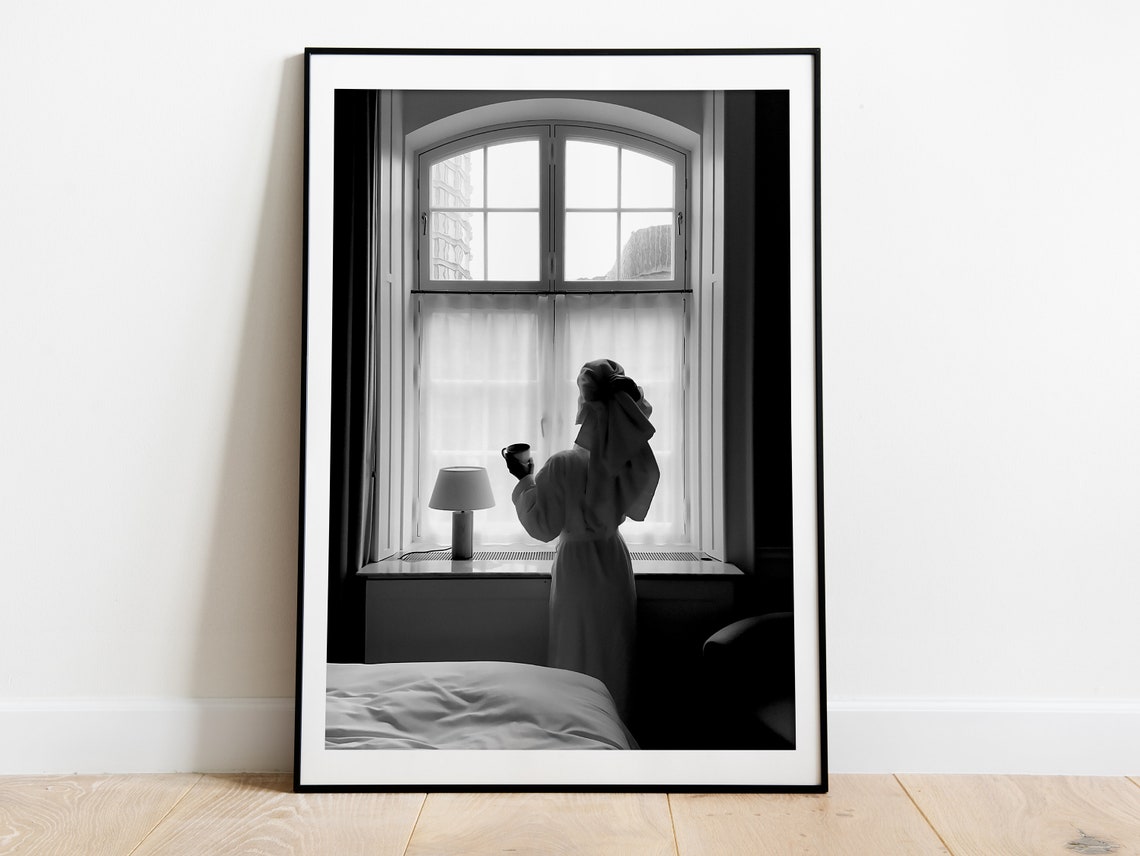 Woman in Robe Drinking Coffee by Window Black and White Photo Poster - Image 3