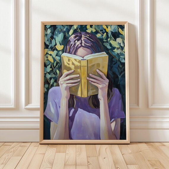 Woman Reading with Book Covering Her Face Among Green Foliage Poster