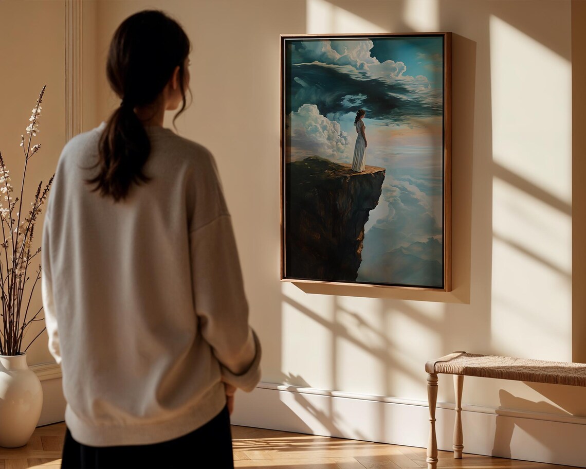 Woman in White Dress Standing on a Cliff Above a Sea of Clouds Poster - Image 5