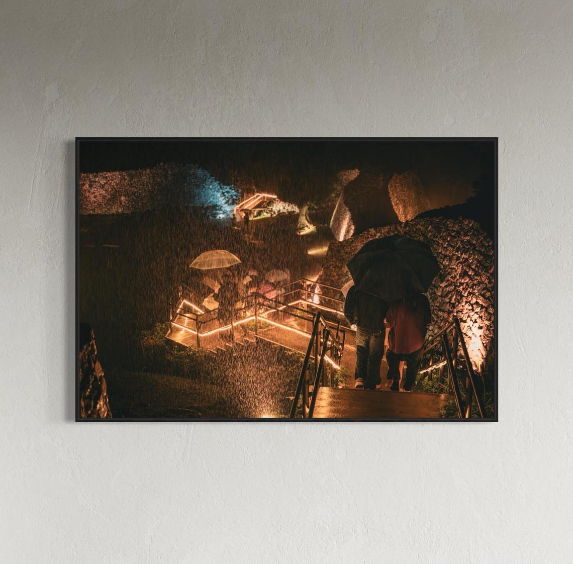 Night Lights Glowing at an Ancient Stone Ruin with Umbrellas Poster