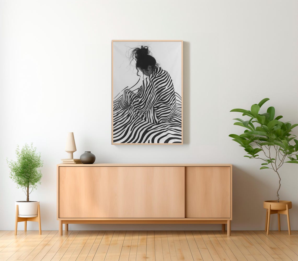 Black and White Striped Woman Seated in Contemplative Pose Poster - Image 2