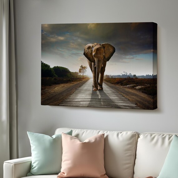 Elephant Walking Down Dirt Road Toward Camera Dramatic Sky Poster