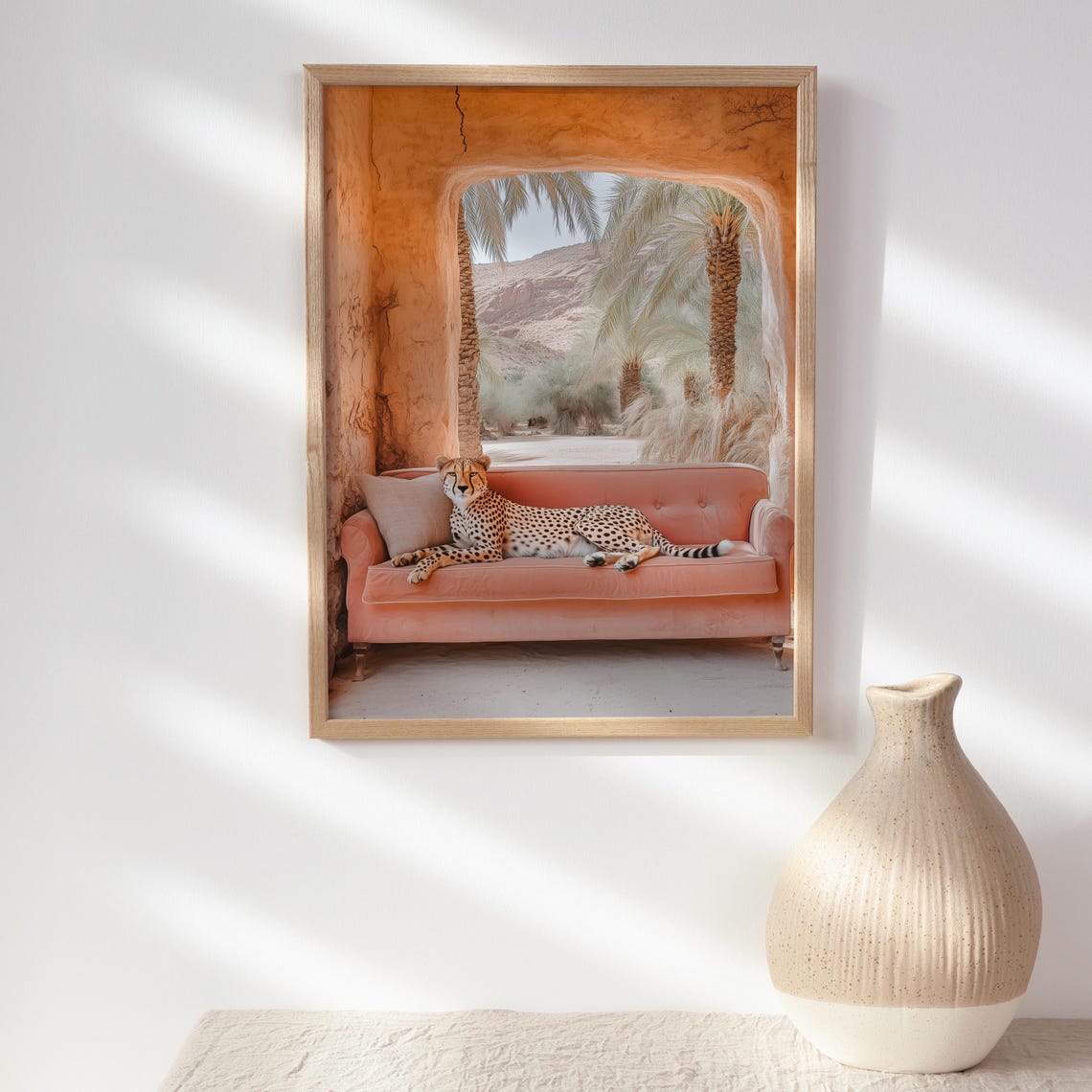 Whimsical Cheetah Lounging on a Pink Sofa in a Desert Arch Poster - Image 2