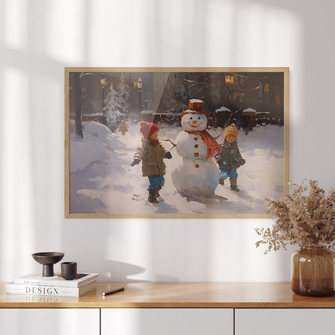 Two Children Building a Snowman on a Snowy Village Street Poster - Image 3