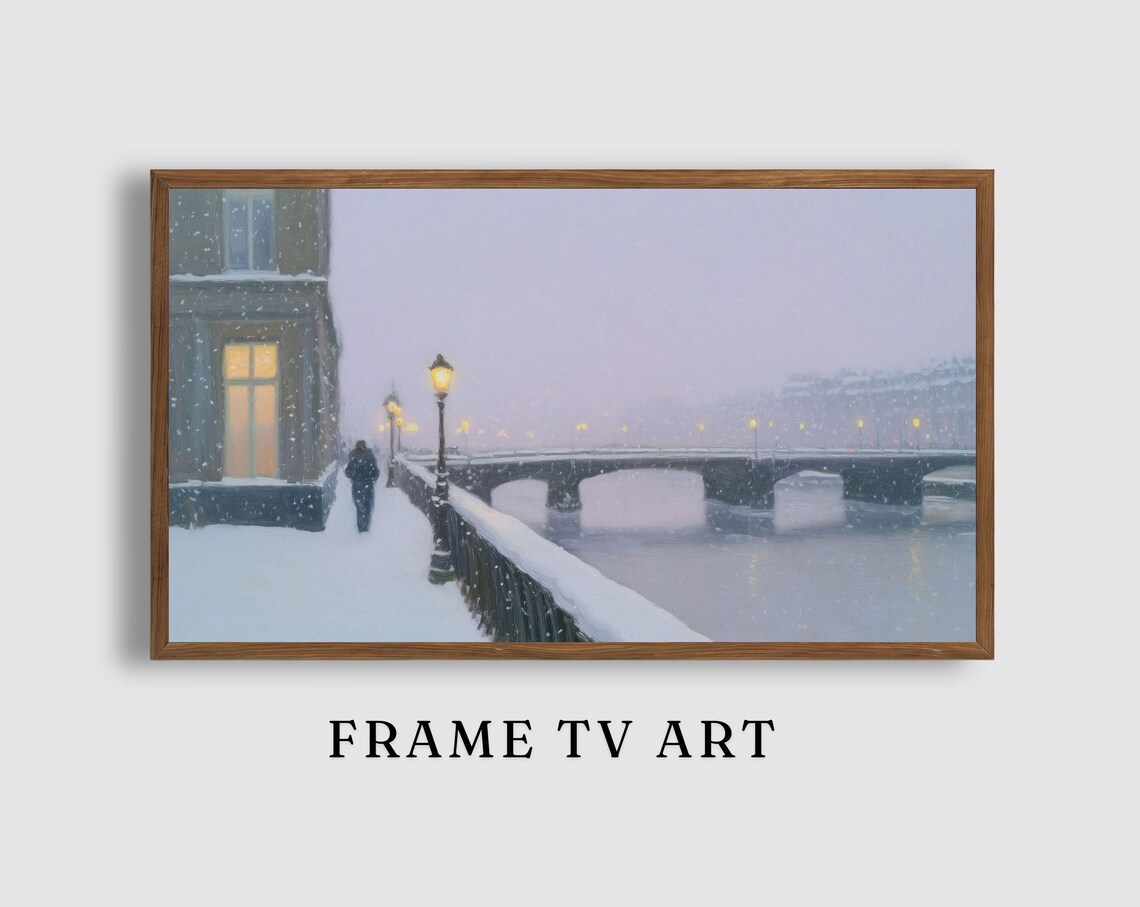 Snowy River Promenade with Lampposts Stone Bridge and Warm Windows Poster