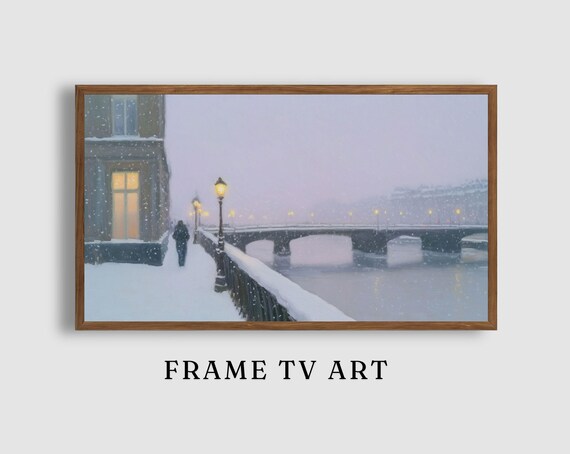 Snowy River Promenade with Lampposts Stone Bridge and Warm Windows Poster