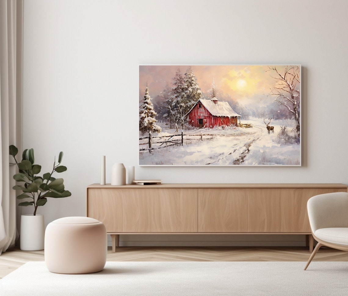 Red Barn In A Snowy Field At Sunrise With A Grazing Deer Poster - Image 2