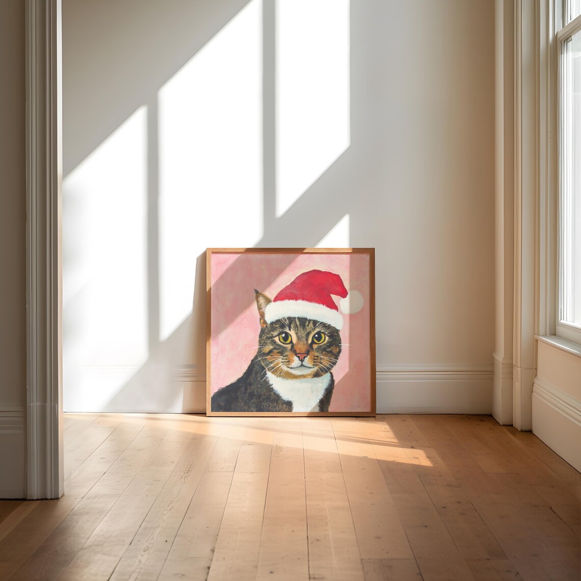 Brown Tabby Cat Wearing Santa Hat on Pink Christmas Portrait Poster