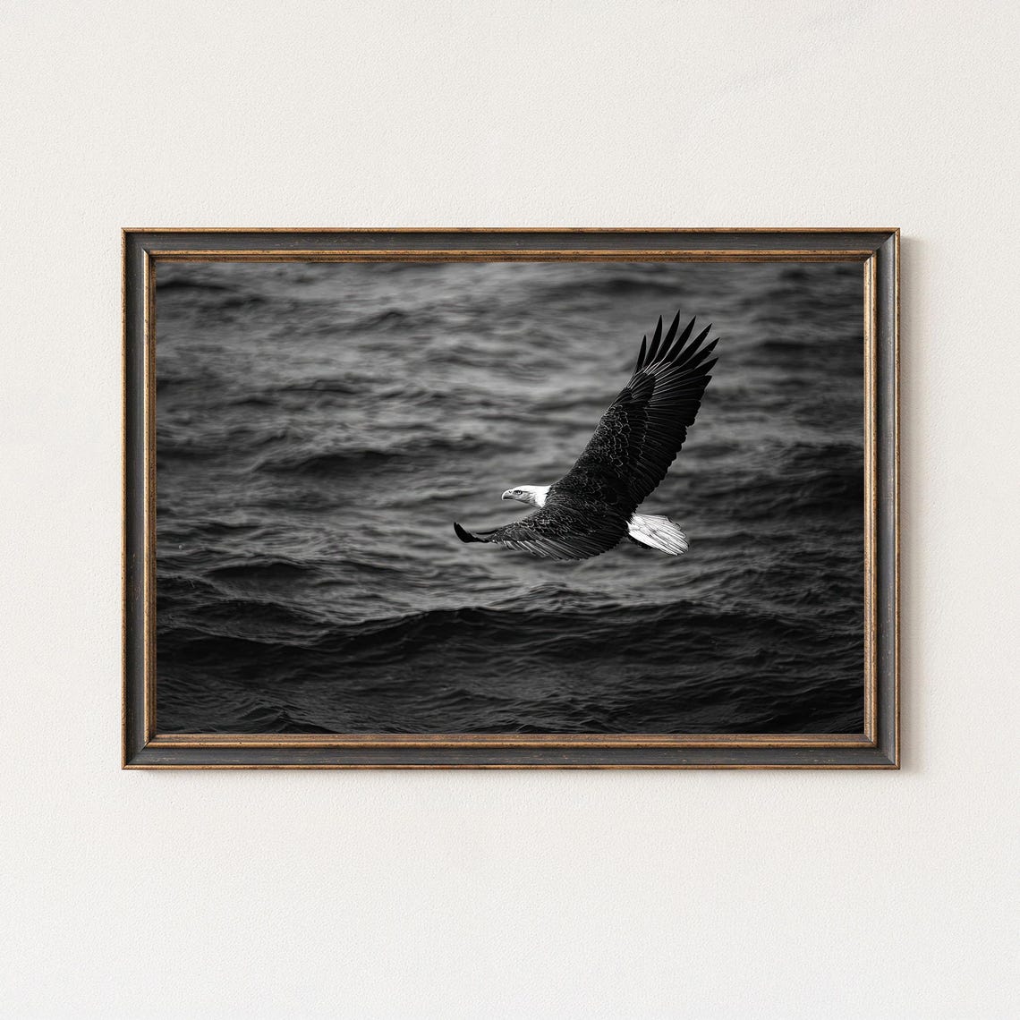 Bald Eagle Gliding Over Dark Ocean Waves Black And White Poster