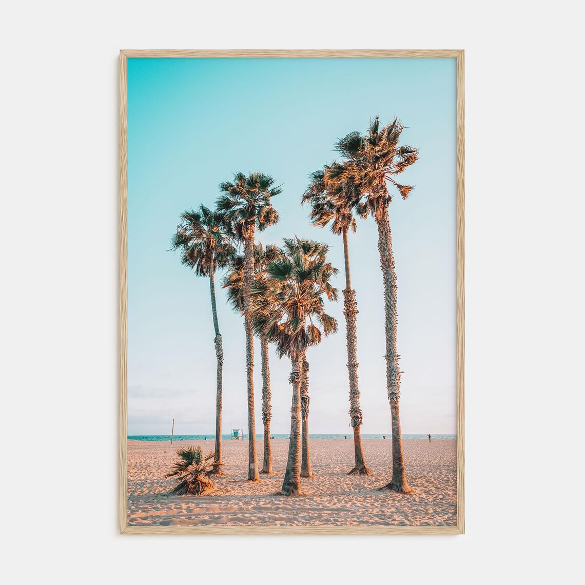 Cluster of Palm Trees on a Sandy Beach at Sunset by the Ocean Poster