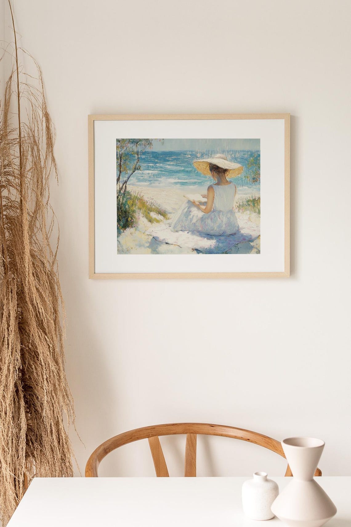 Woman in a Straw Hat Reading on a Beach Facing the Blue Ocean Poster - Image 2