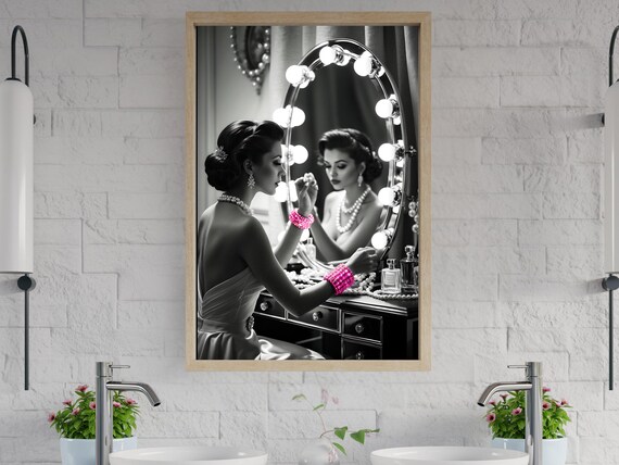 Woman Applying Lipstick at a Hollywood Vanity Mirror With Pink Accents Poster