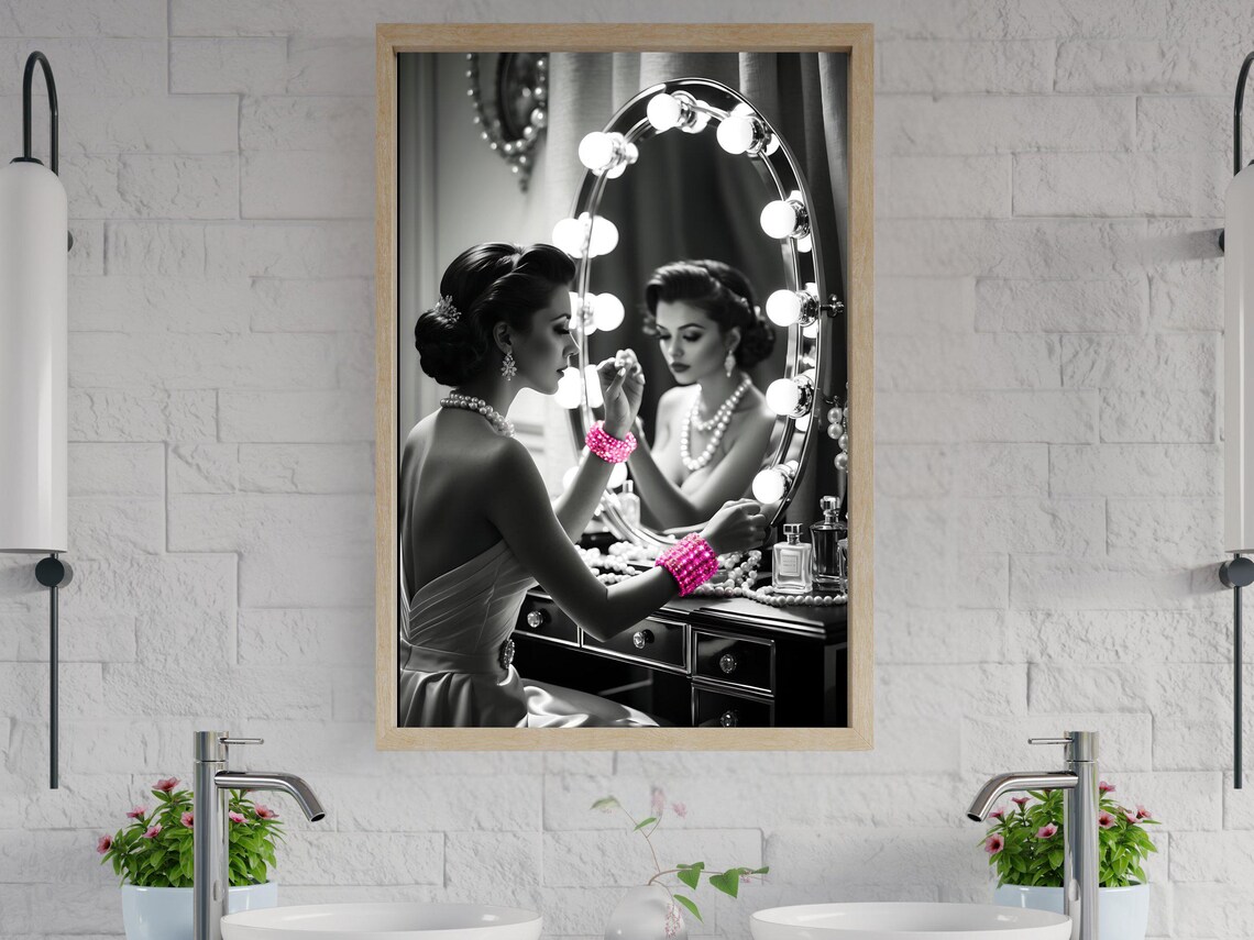 Woman Applying Lipstick at a Hollywood Vanity Mirror With Pink Accents Poster