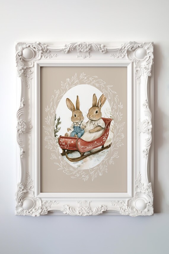 Two Cute Bunnies Riding a Red Sleigh in Snowy Winter Scene Poster