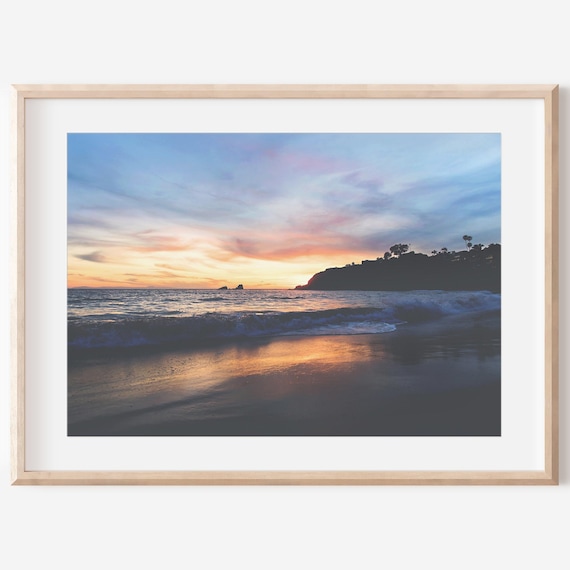 Breathtaking Sunset Over Rolling Ocean Waves at the Beach Poster