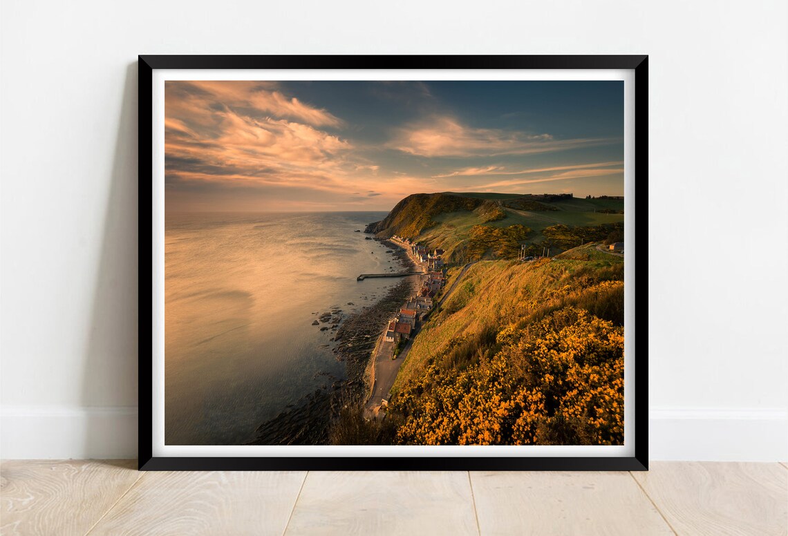 Coastal Village on Cliffs at Golden Sunset Over the Sea Poster