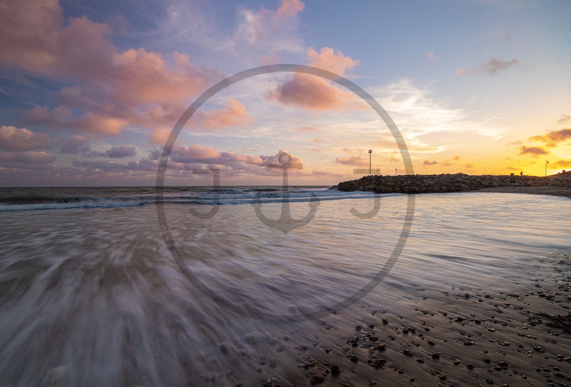 Golden Sunset Over Ocean Beach Waves with Rocky Breakwater Poster - Image 3