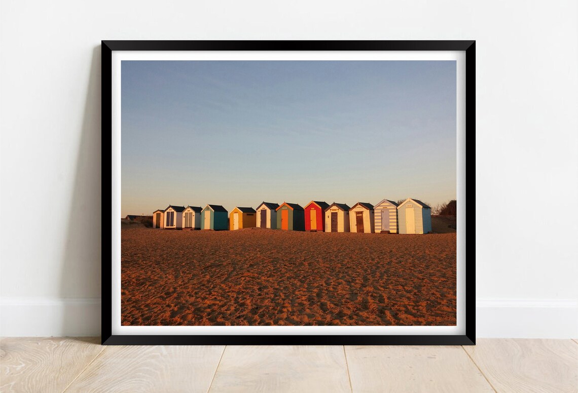 Colorful Beach Huts Row on Golden Sand at Dusk Coastal Poster