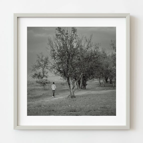 Boy Walking Down The Path In Rural Tanzania Wall Art
