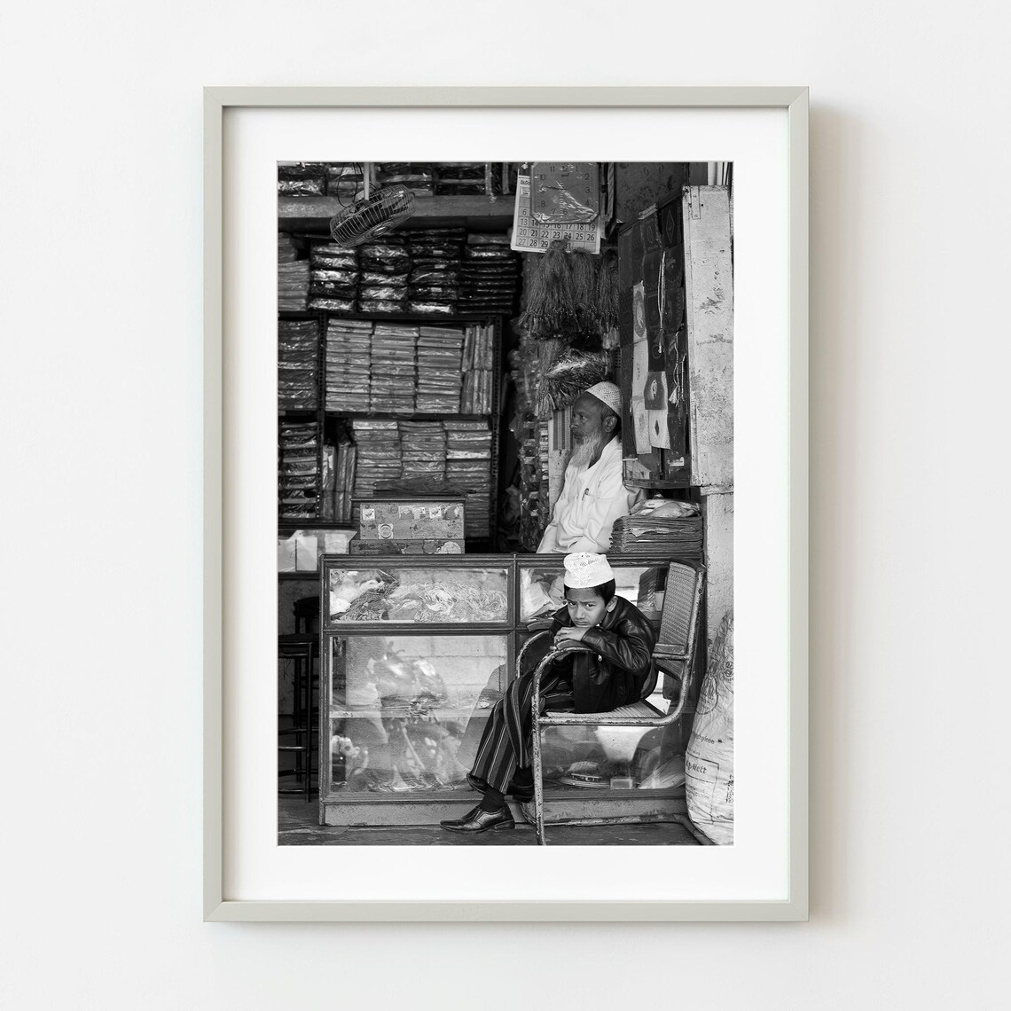 Boy Sitting In A Family Shop Black And White Street Photography Poster