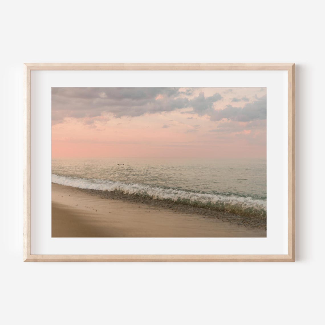 Pastel Pink Sunset Waves Washing Over a Quiet Sandy Beach Poster