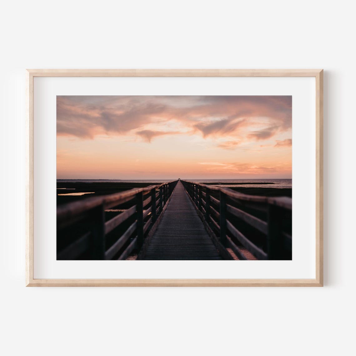 Wooden Boardwalk to the Beach Under a Pink Sunset Sky Poster
