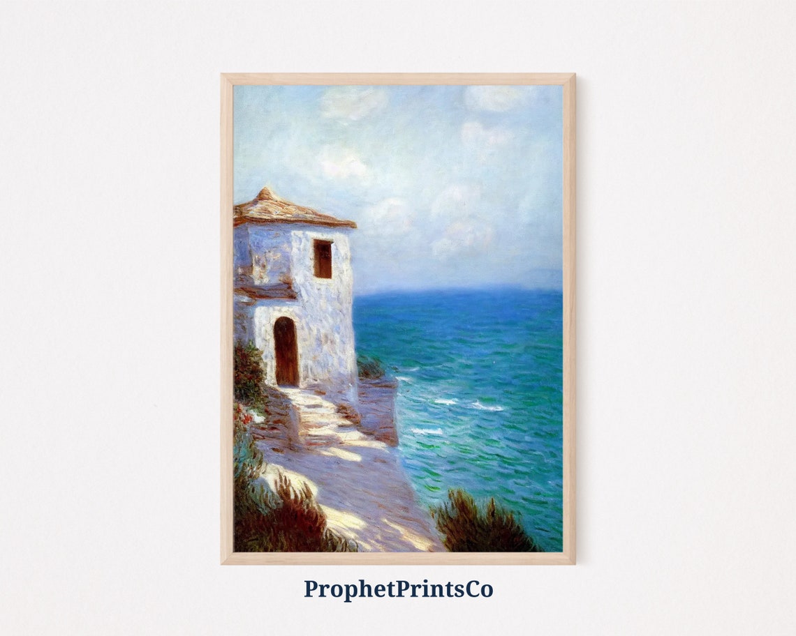White Cliffside House Above a Bright Blue Sea Painting Poster