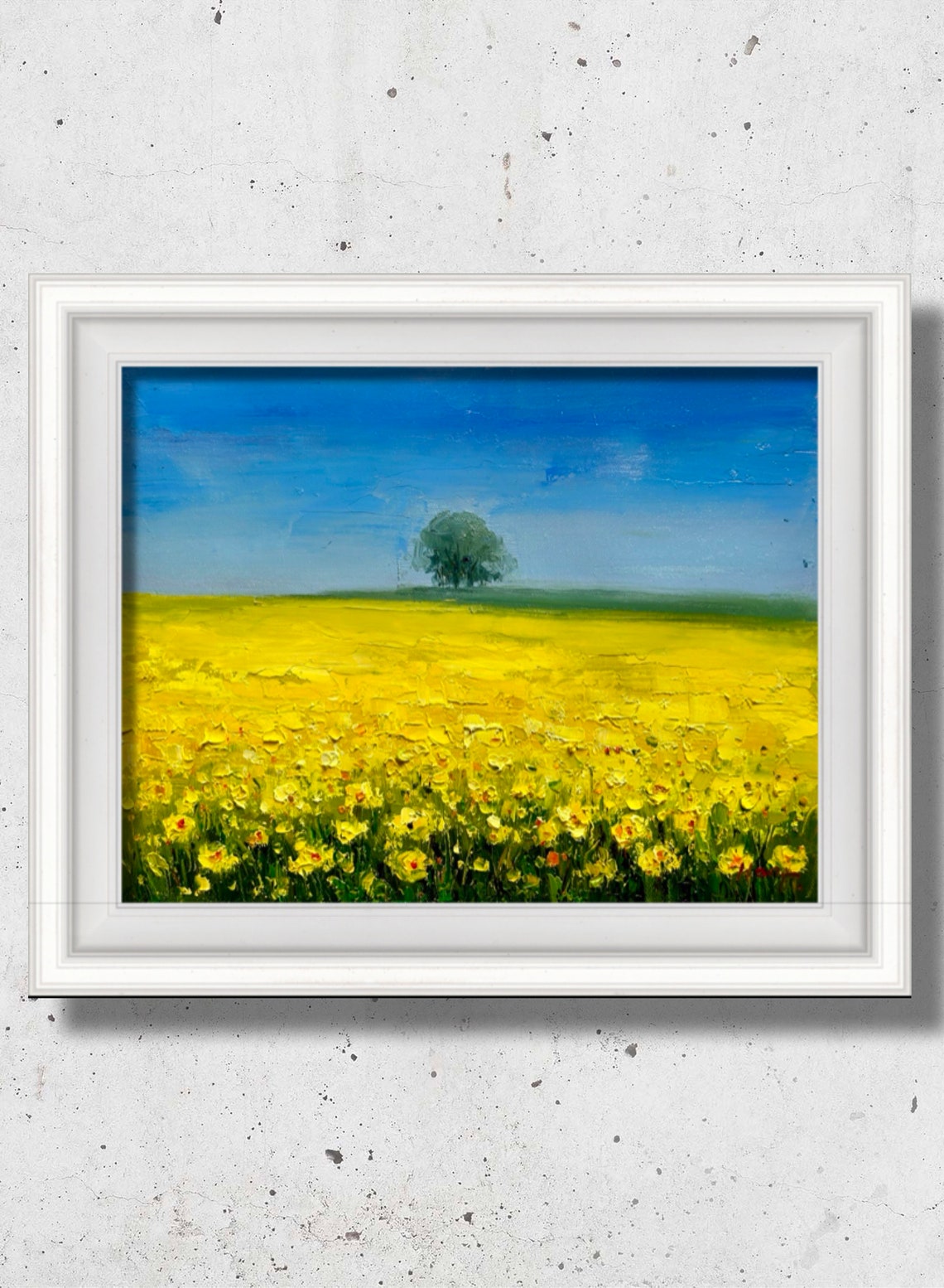 Bright Yellow Rapeseed Field With Lone Tree Under Blue Sky Poster
