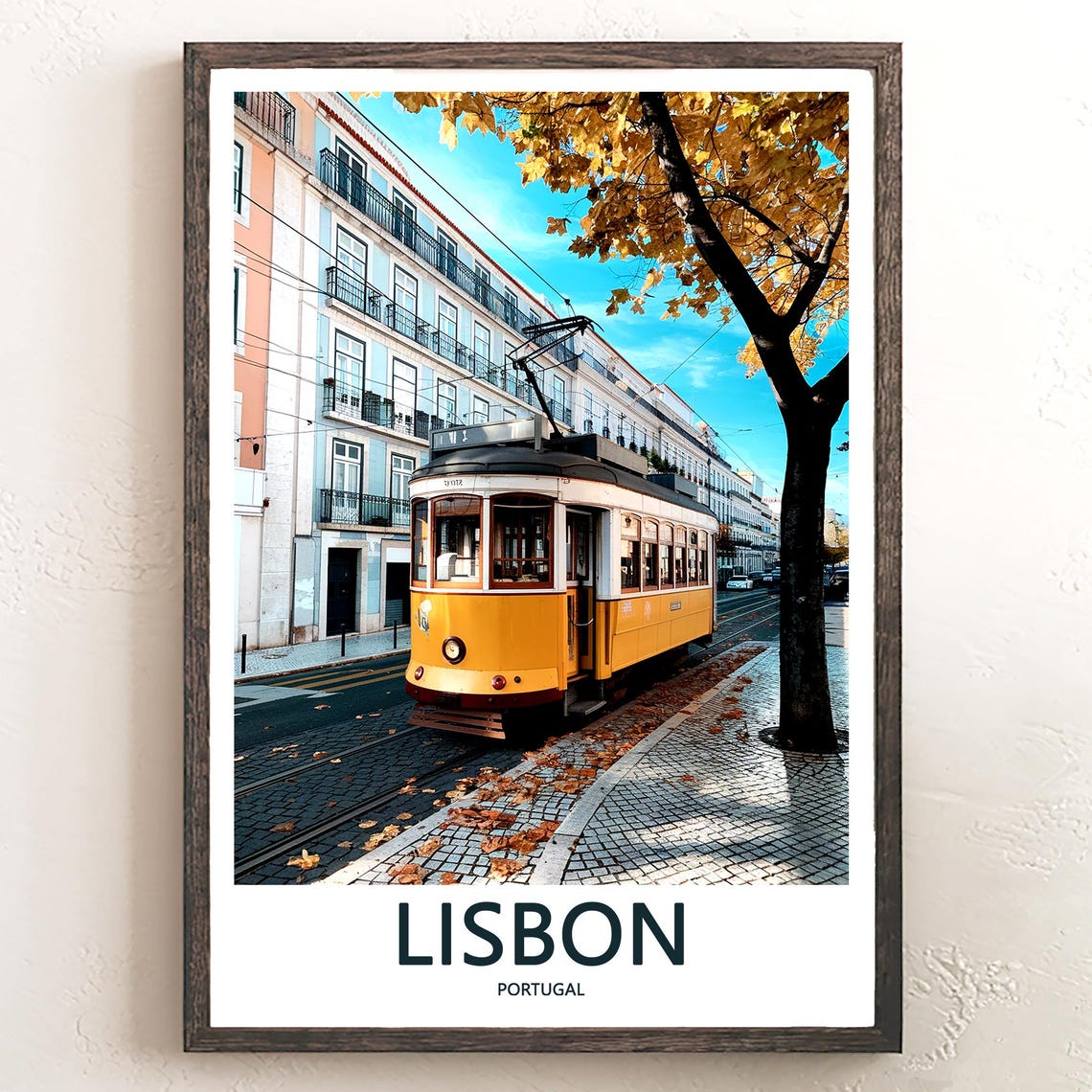 Lisbon Yellow Tram on a Leaf-Covered Boulevard in Fall Season Poster