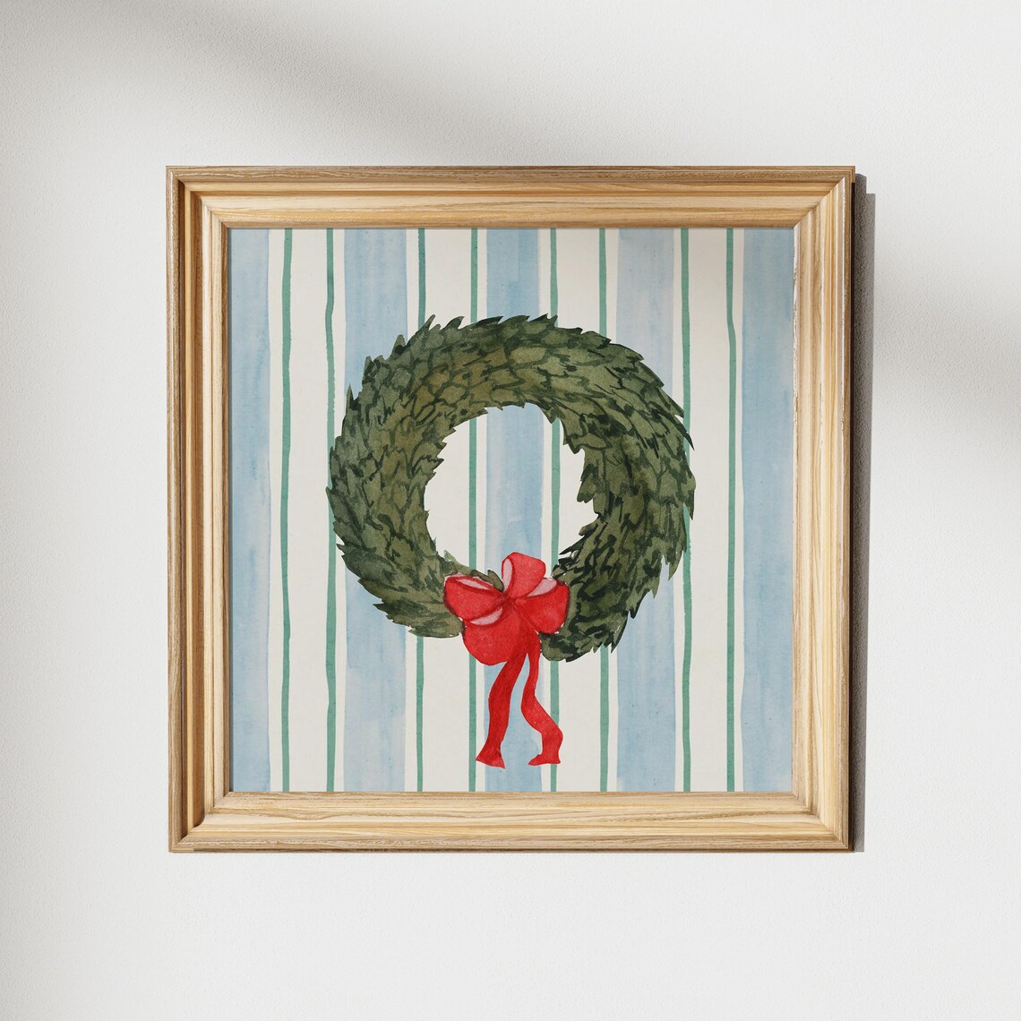 Green Christmas Wreath with Red Bow on Striped Blue Background Poster - Image 5