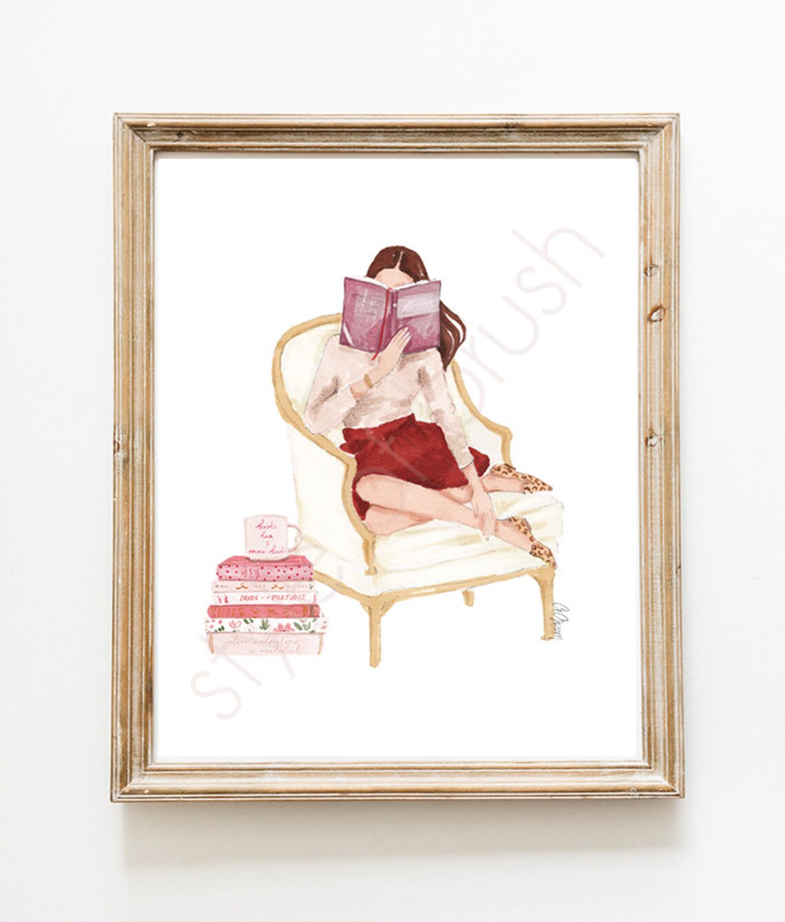 Woman Reading on Cream Armchair with Stack of Pink Books Poster - Image 2