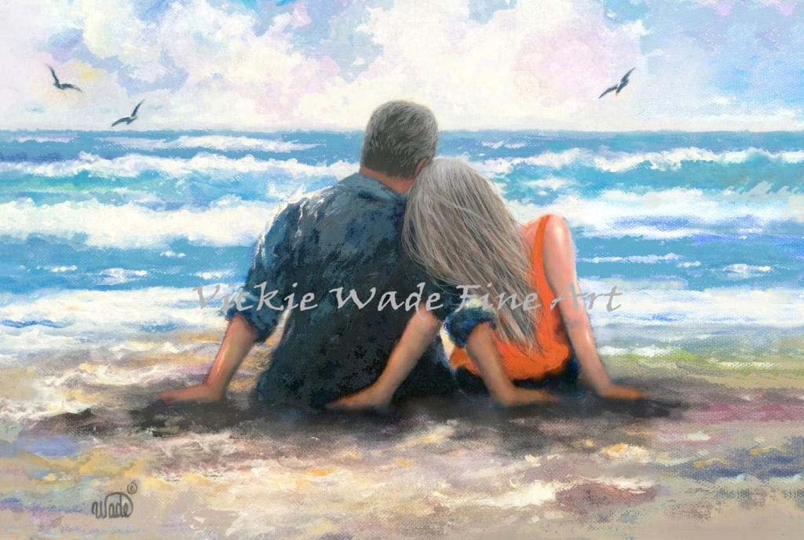 Gray Haired Couple Sitting Together at the Ocean Shore Poster
