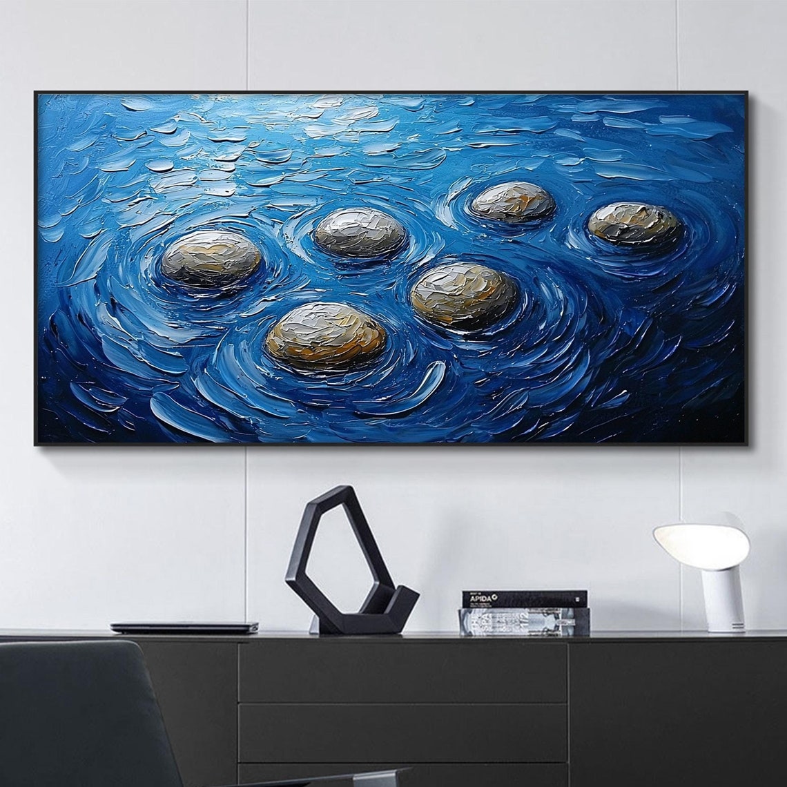 Six Smooth River Stones Floating In Bright Blue Swirling Water Poster