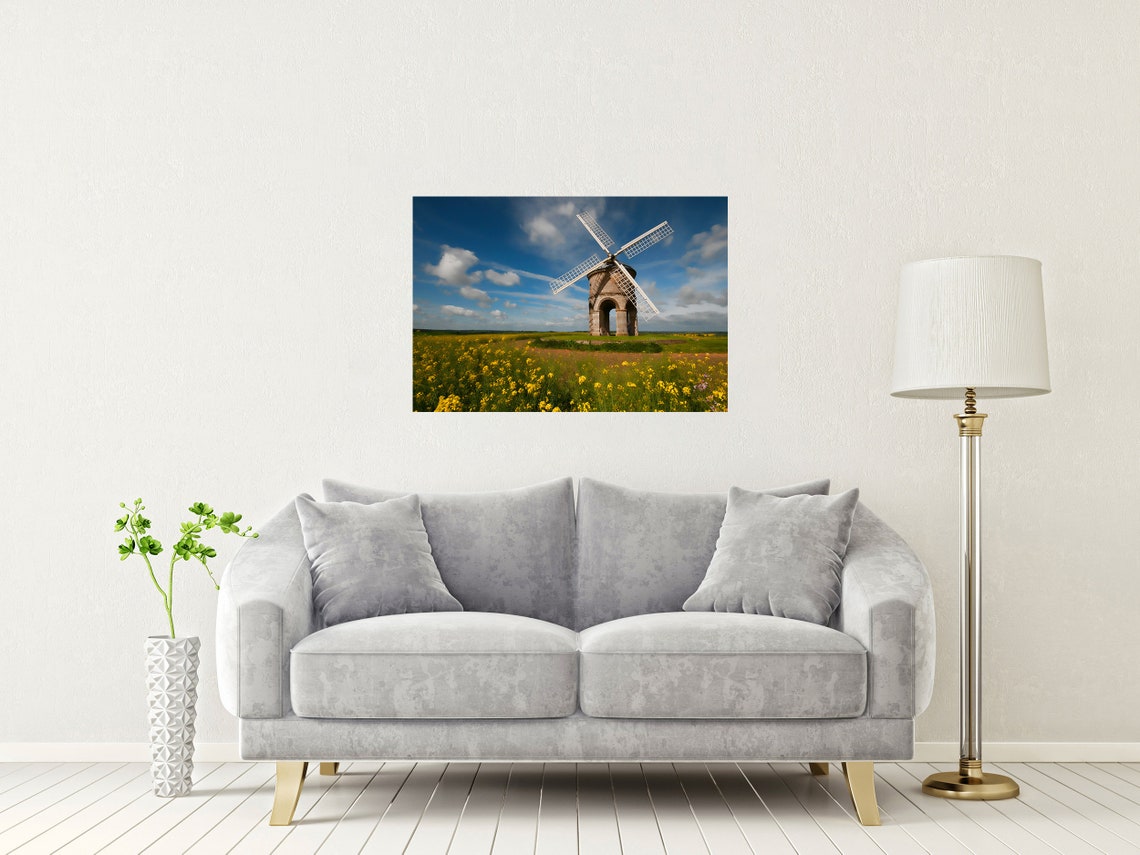 Historic Stone Windmill in a Wildflower Meadow Under Blue Sky Poster - Image 2