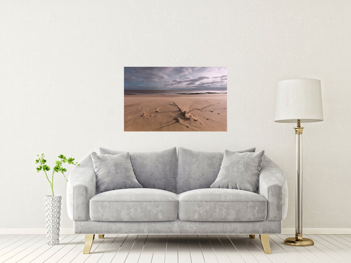 Minimalist Driftwood on an Empty Beach Under a Vast Cloudy Sky Poster - Image 2