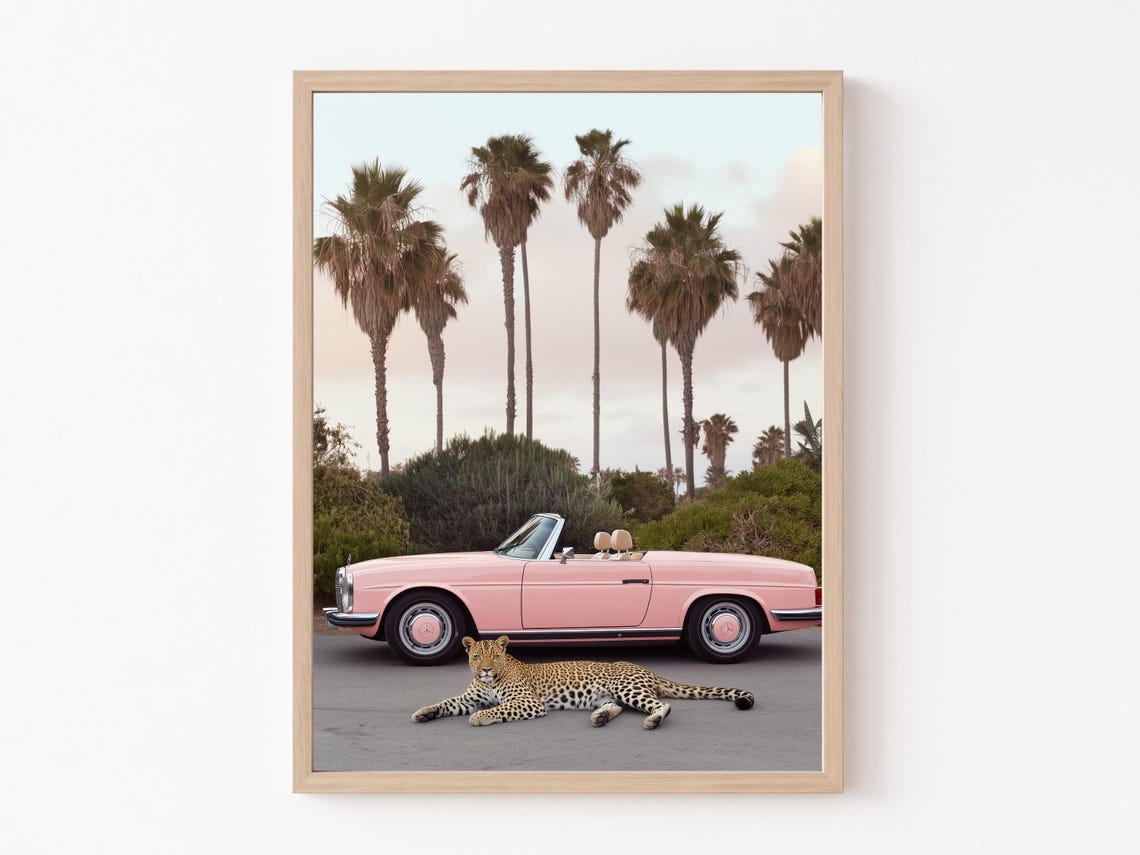 Playful Leopard Lounging Before a Pink Vintage Convertible Poster