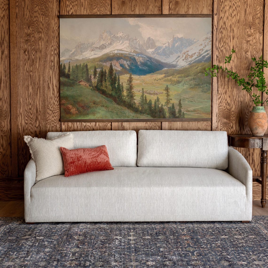 Alpine Valley with Snow Capped Peaks and Mountain Chalet Poster