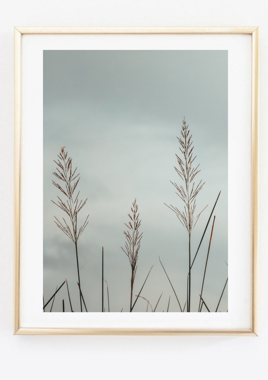 Minimalist Tall Grass Seed Heads Against Soft Gray Sky Art Poster - Image 2