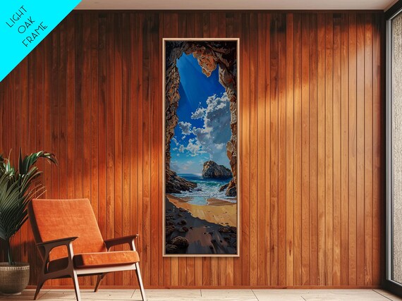 Framed Print Skinny Art Of A Sunlit Beach Scene Framed By Rocky Cliffs Overlooking A Crystal Blue Sea Under A Clear Sky