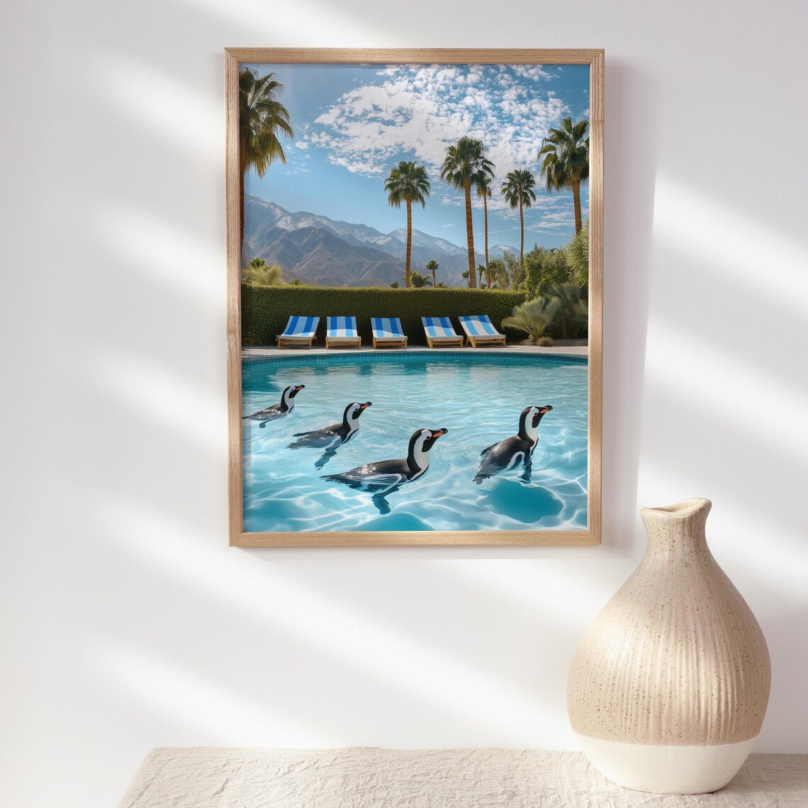 Five Penguins Swimming in a Resort Pool with Blue Sun Loungers Poster - Image 2