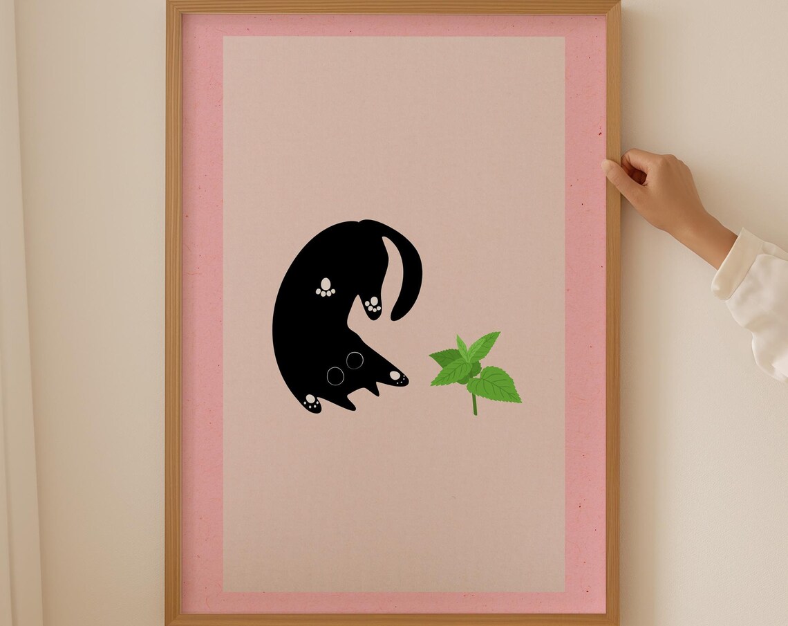 Curious Black Cat Reaching for a Green Leaf Pink Minimalist Poster