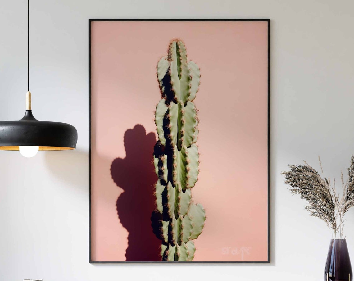 Solitary Tall Cactus Column with Bold Shadow on a Peach Poster