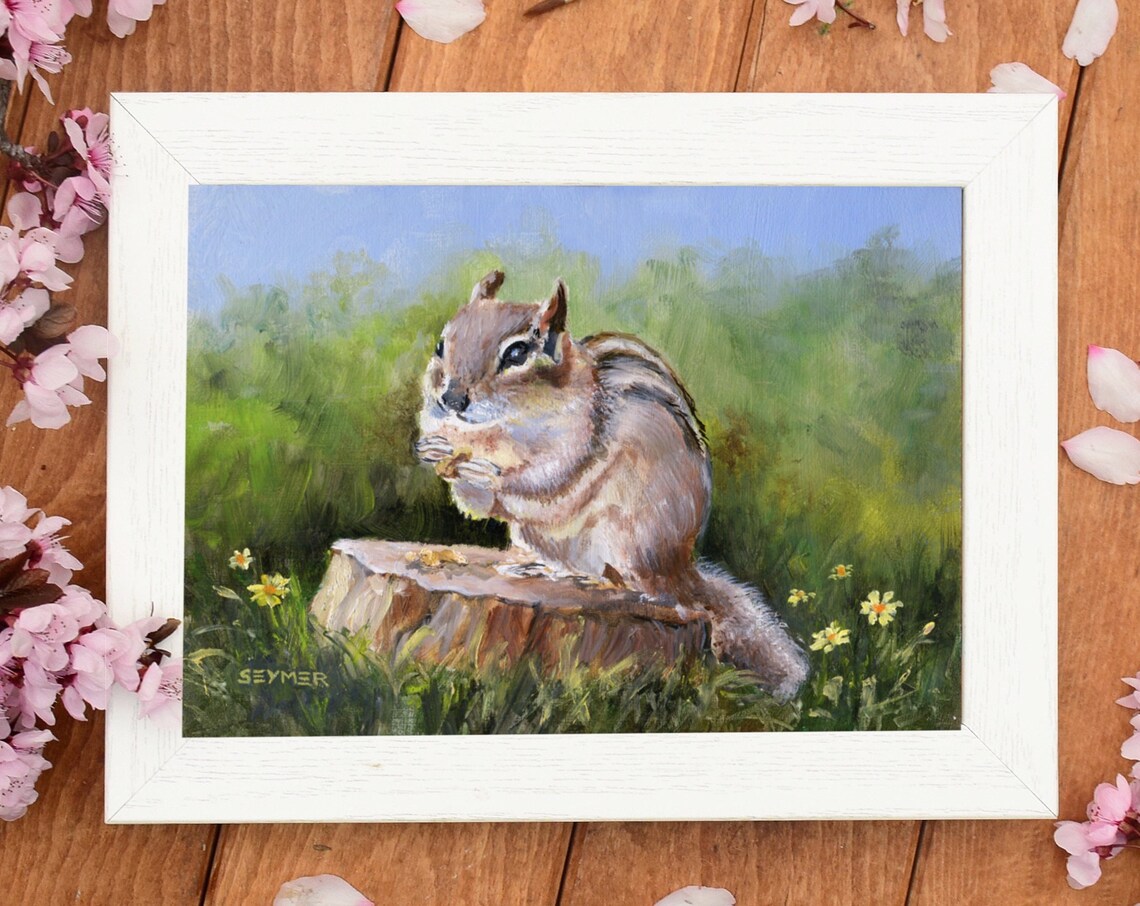 Cute Striped Chipmunk Sitting on a Tree Stump in a Sunny Meadow Poster - Image 2