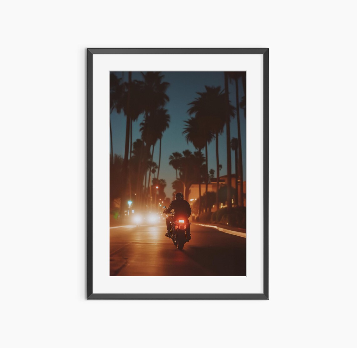 Motorcycle Rider on Palm Lined Night Street Cinematic Photo Poster