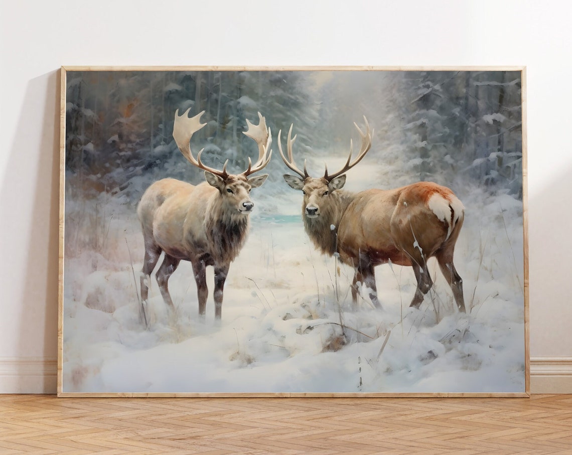 Two Majestic Stags Standing in Snow with Winter Forest Behind Poster