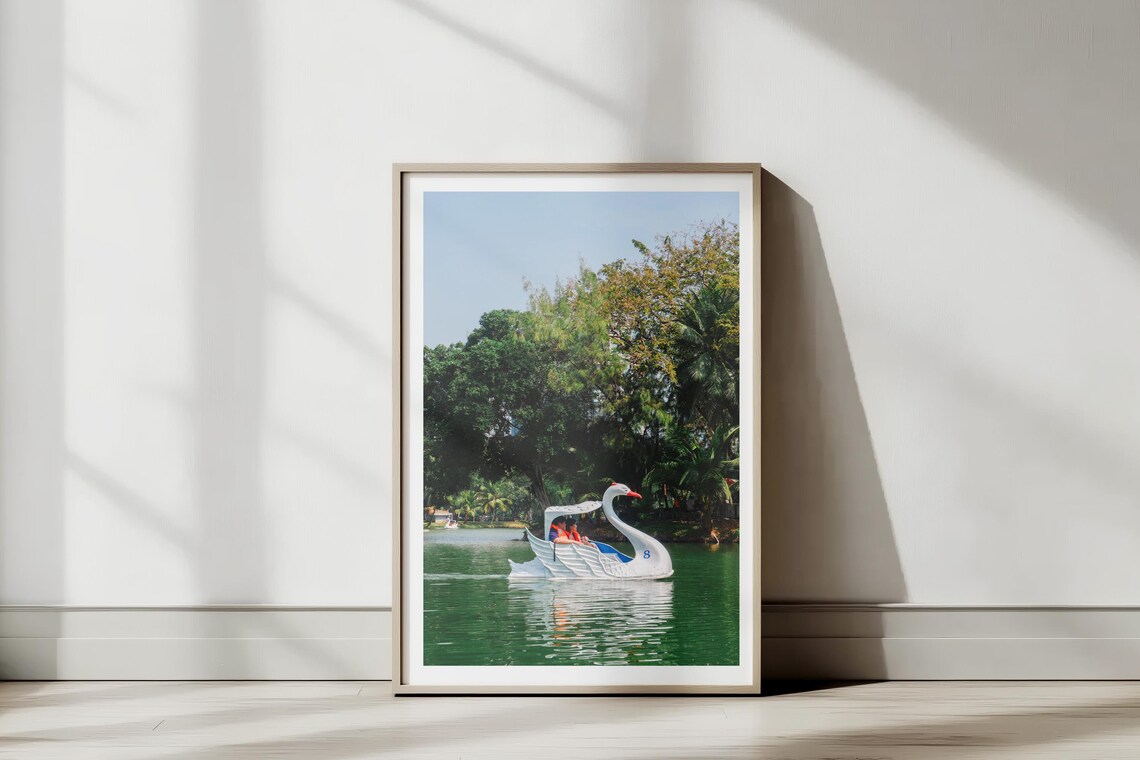Sunlit Swan Pedal Boat on a Tropical Park Lake Serene Travel Poster